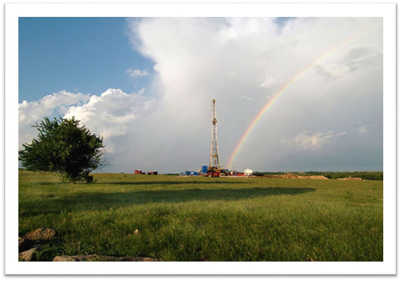 Rainbow over drilling rig.